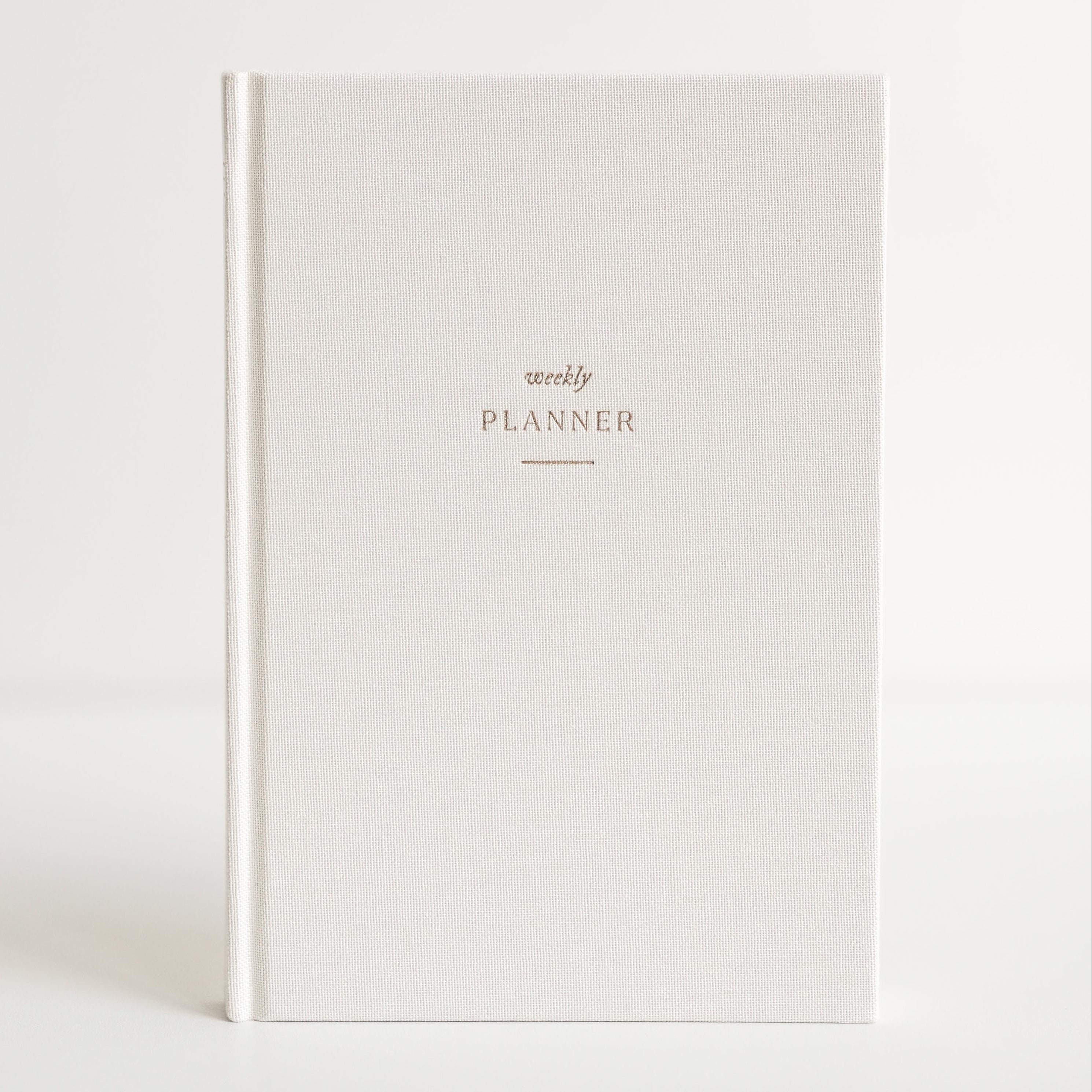Cream linen Strawberry Goose Weekly Planner with gold foil lettering